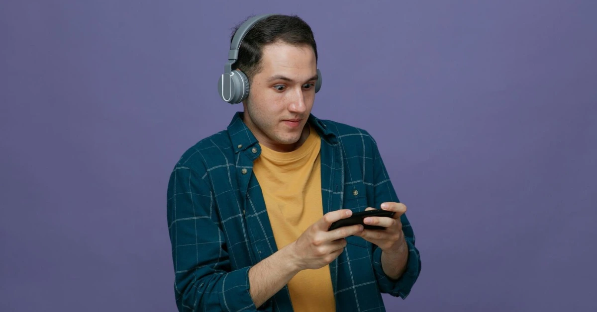 boy acting like he's playing games on smartphone