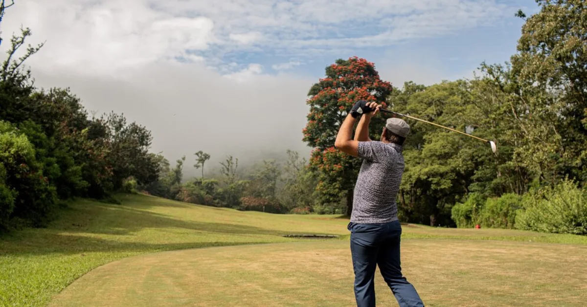 Man rotating golf club