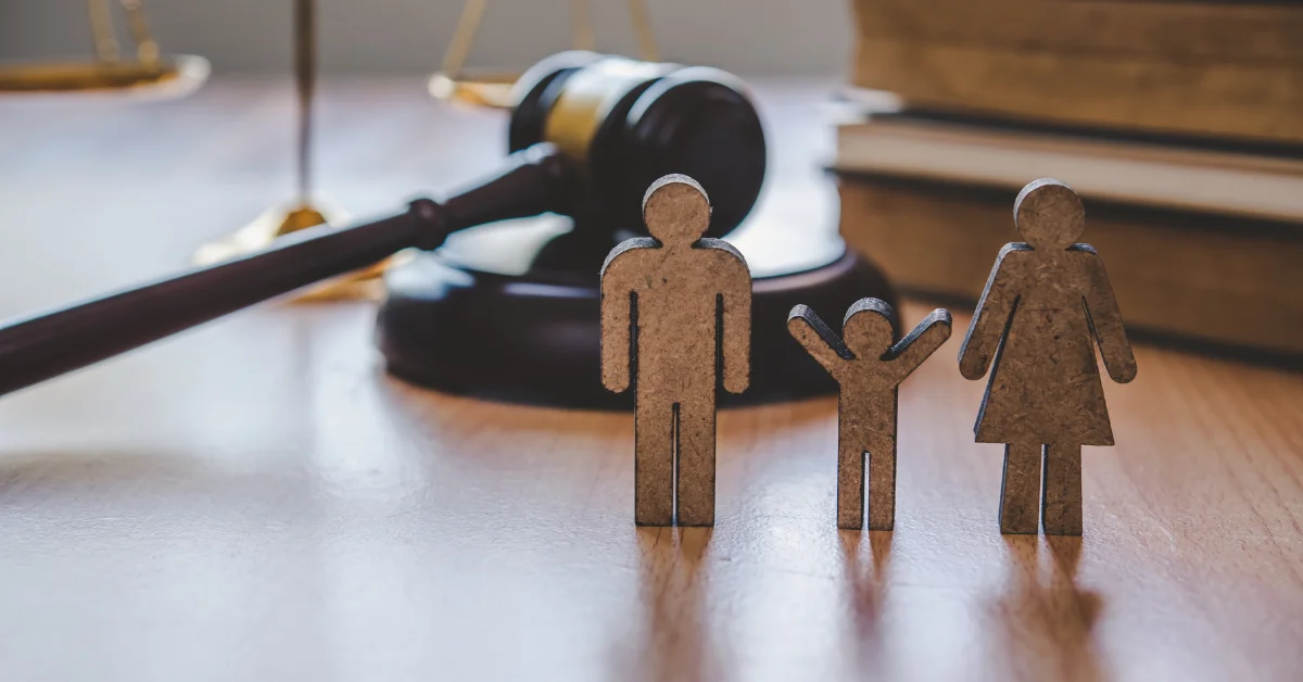 wood crafted father, child, and mother - family law
