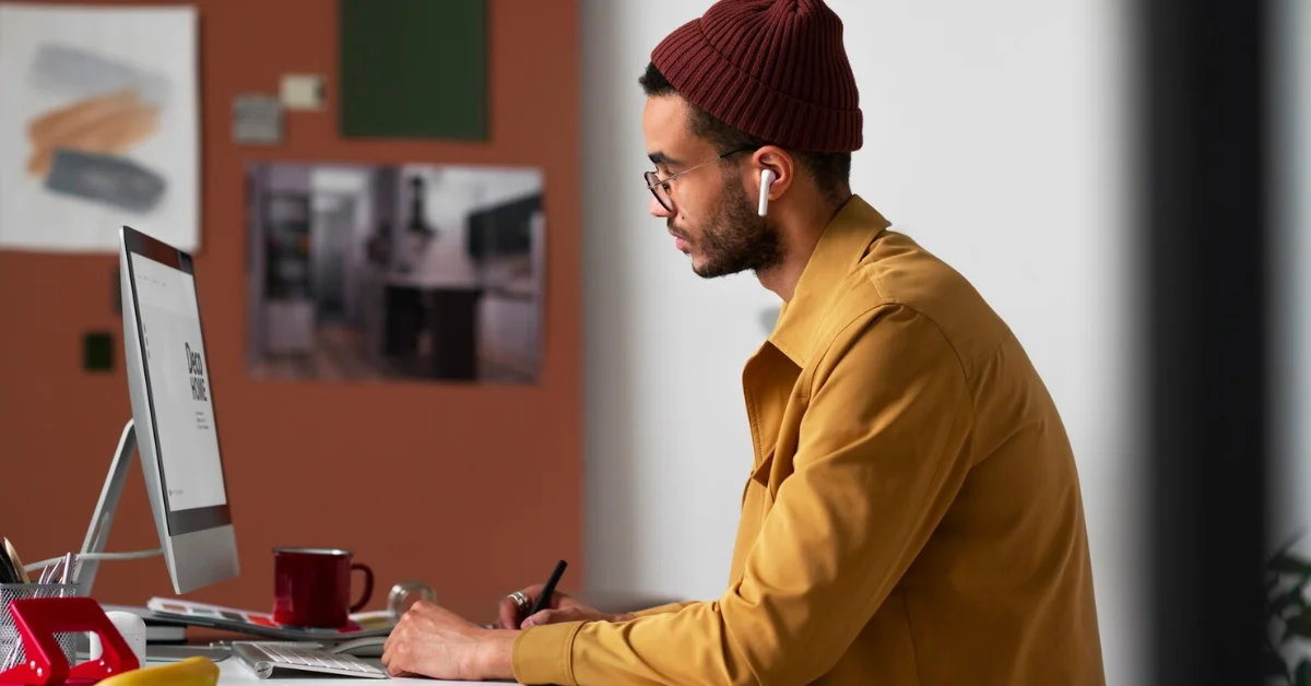 a graphic designer man working on a PC