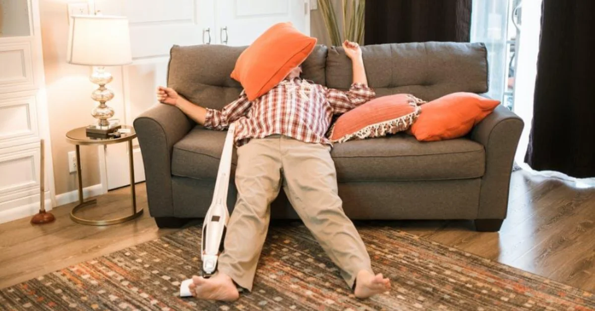 a lazy man lying on sofa