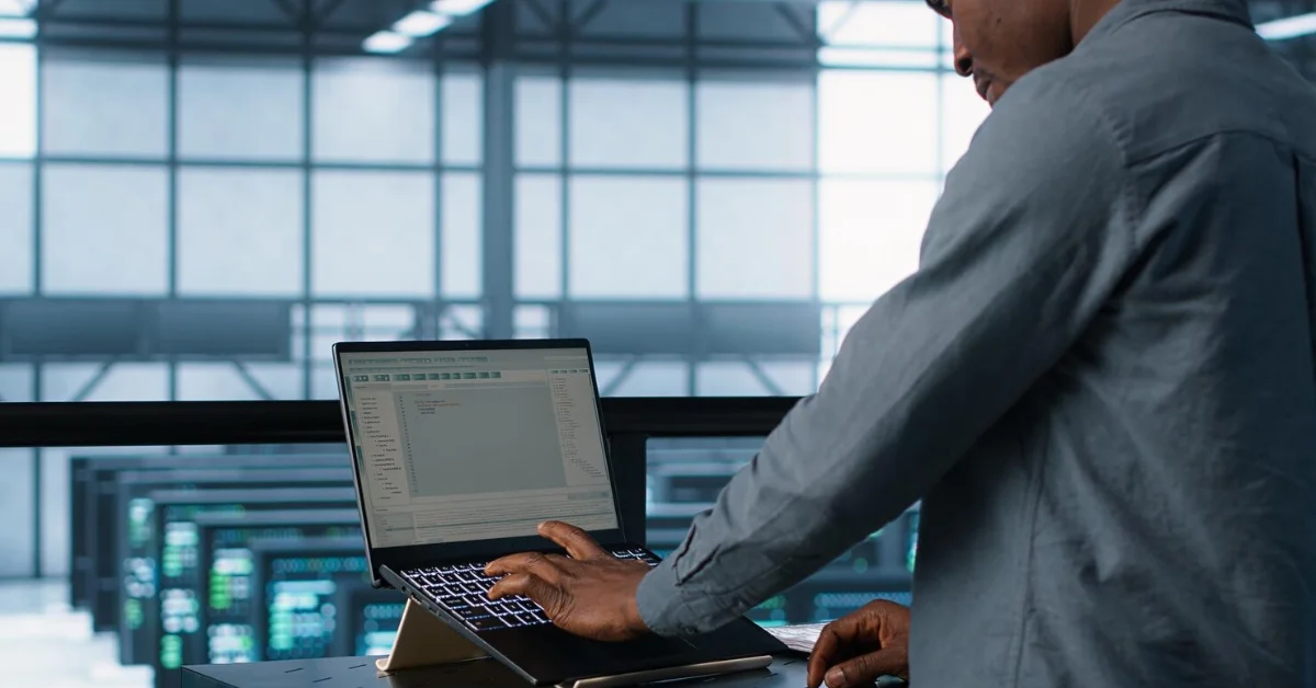 a man doing data backup on laptop
