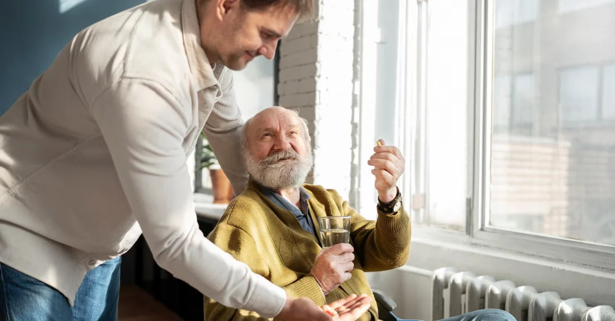 a young man taking care of an old man