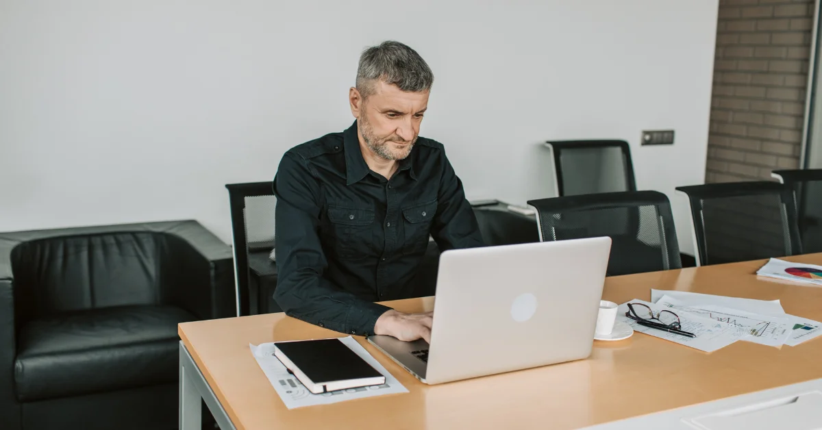 an employee using laptop in office