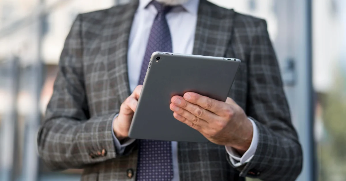 a professional man using iPad