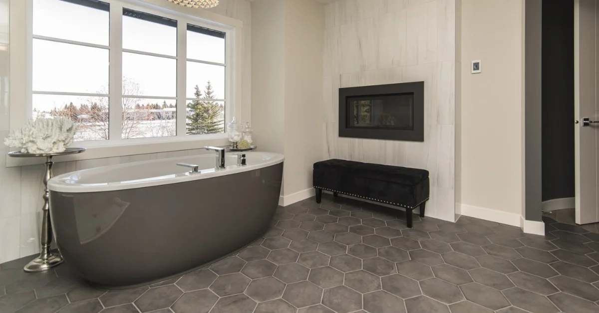 a bathroom with grey tiles