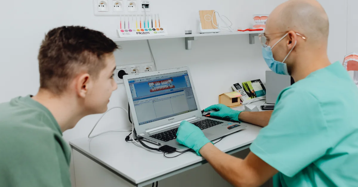 a dentist using laptop
