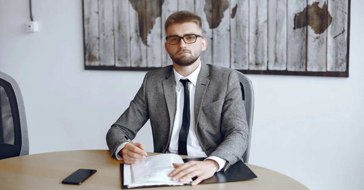 a lawyer writing on documents