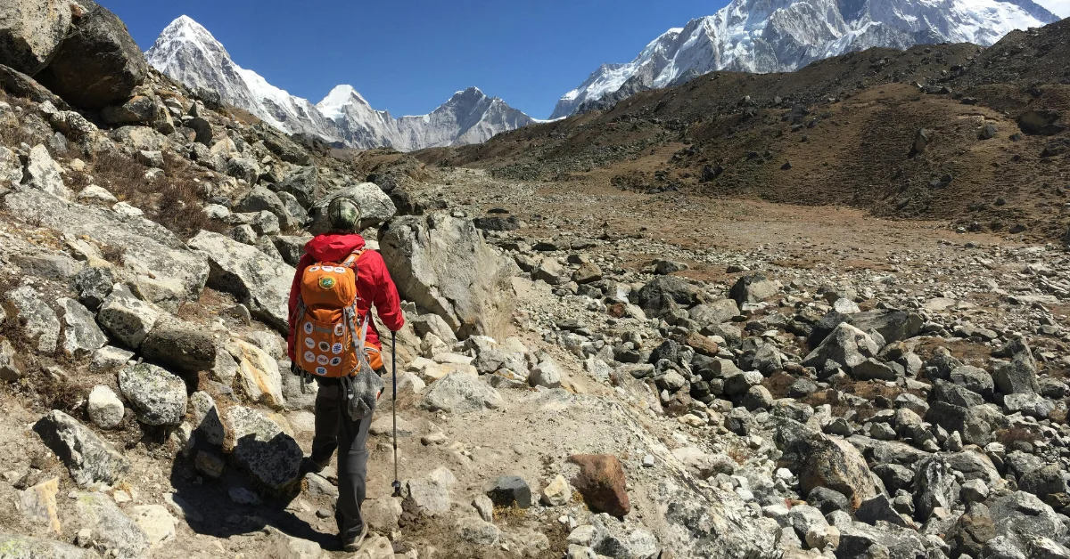 a man climbing mountain