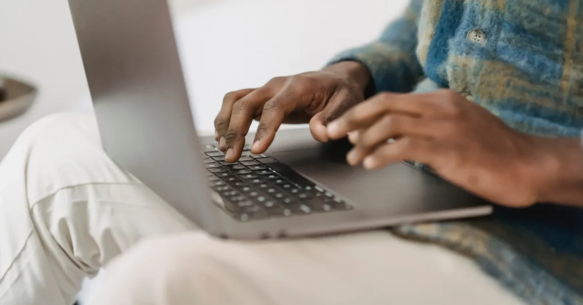 african man using laptop